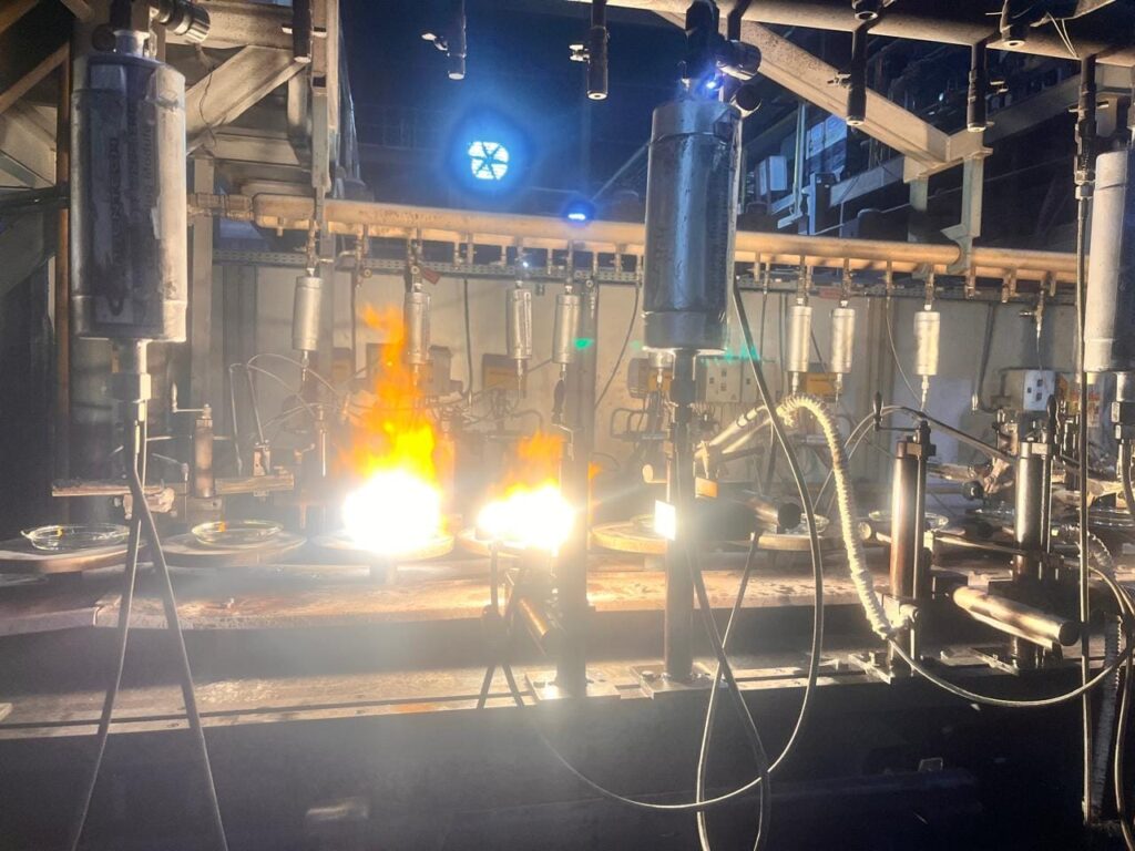 Burners and Greentech modules on a glassware production line